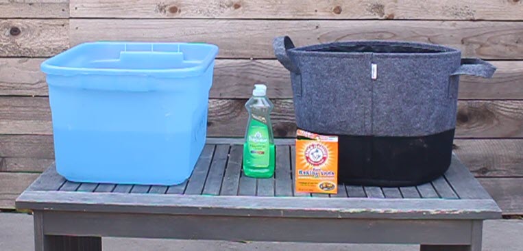 Fabric grow bags can easily be washed in a plastic storage tub. 